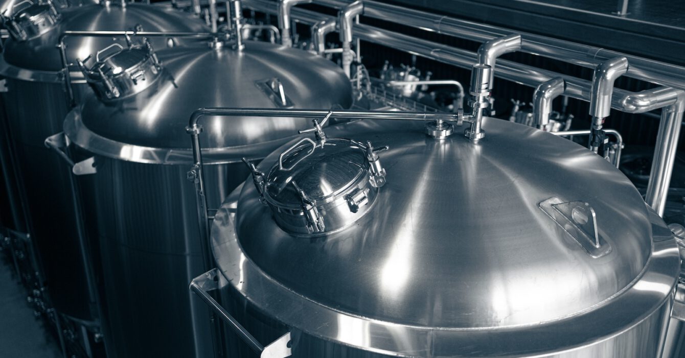 Modern brewery production steel tanks and pipes, machinery tools and vats, beer production